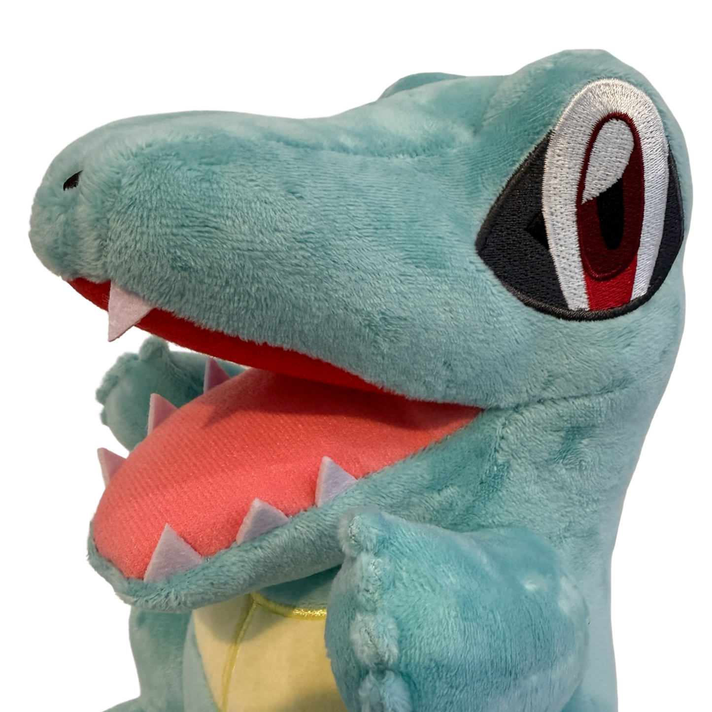 Plush Pokémon Totodile with an open mouth