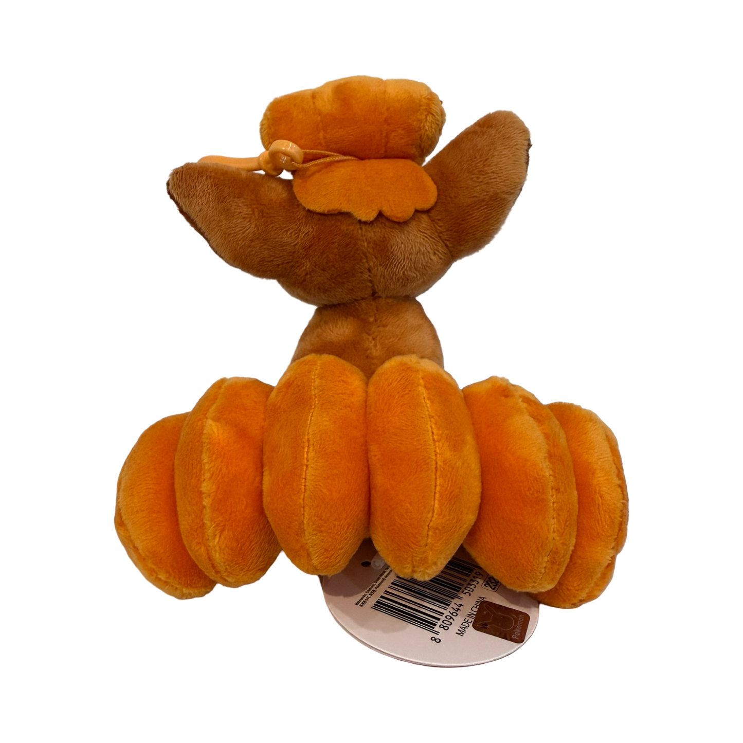 Plush keychain of Pokémon Vulpix. Orangeish red color.