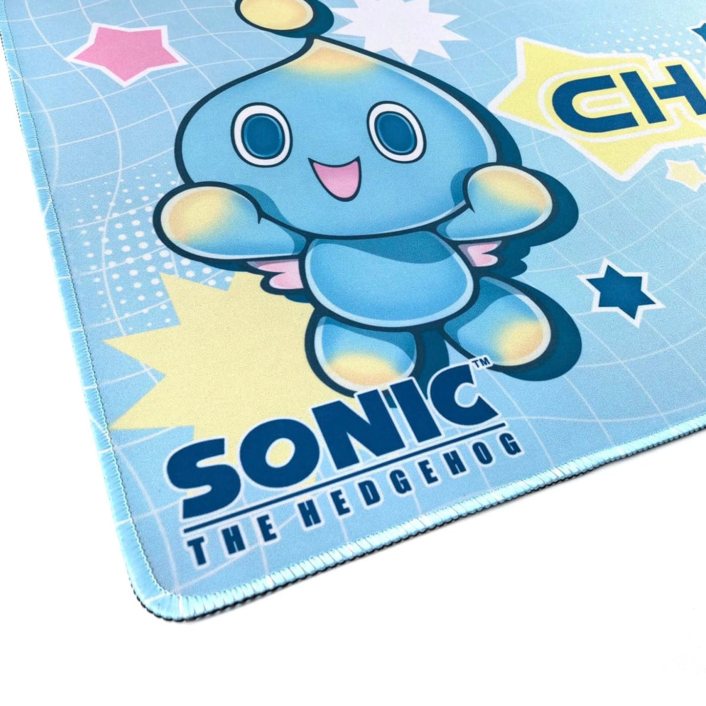 Close up shot of gaming mat showing sewn edges and Chao character from Sonic the Hedgehog.