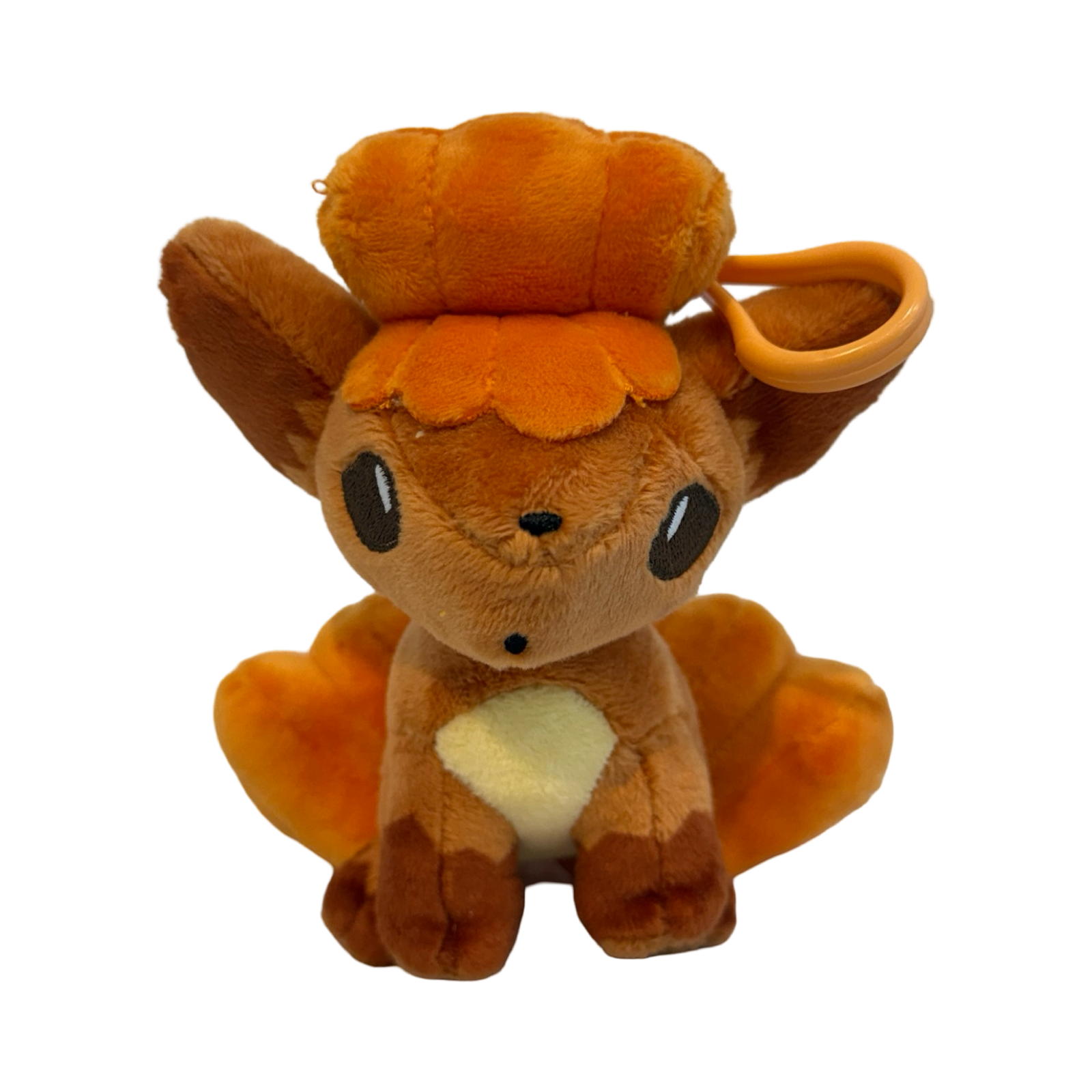 Plush keychain of Pokémon Vulpix. Orangeish red color. 