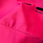 Hot pink fabric showing some snags and pulls in fabric. 