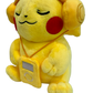 Plush Pikachu wearing headphones and holding a music player on a white background.