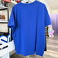 Back of blue tshirt inside a store
