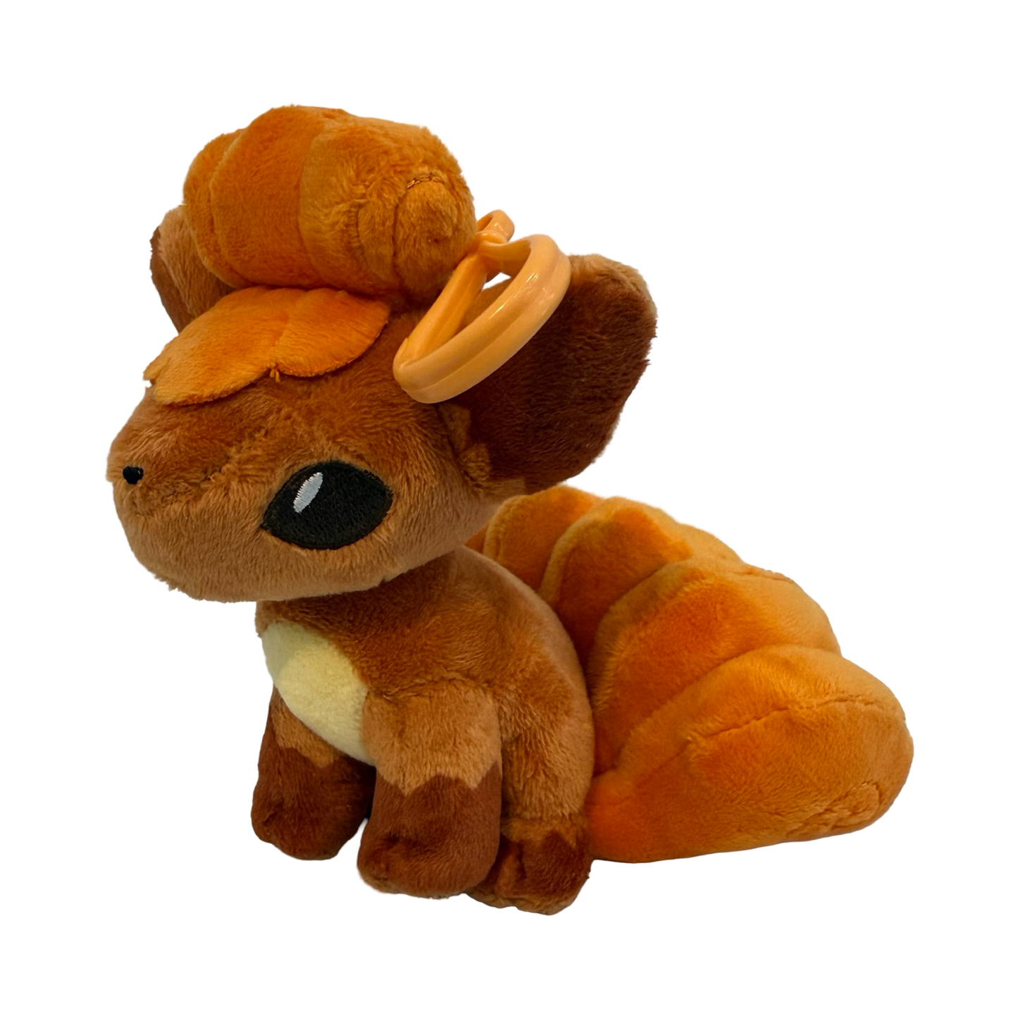 Plush keychain of Pokémon Vulpix. Orangeish red color. 