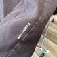 Close up of dark color fabric with white Japanese legal copyright for urusei yatsura. 