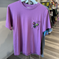 Purple shirt with pocket. On the pocket are three circular graphics of squids from the video game, Splatoon. 