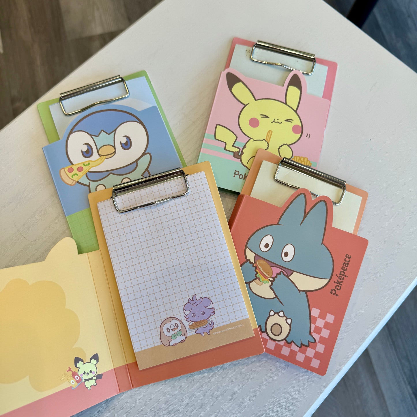 Four Pokémon themed clipboard memo pads with matching printed paper. 