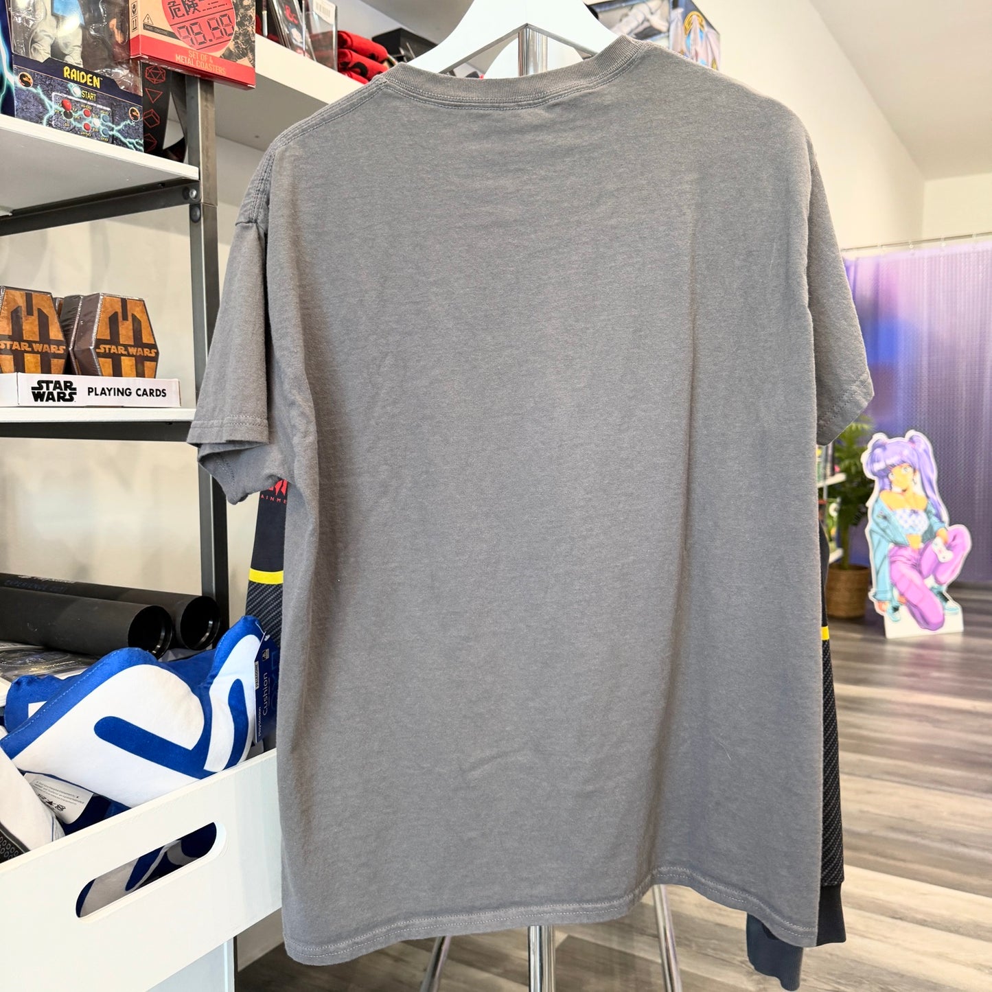 Gray t-shirt  in a store setting