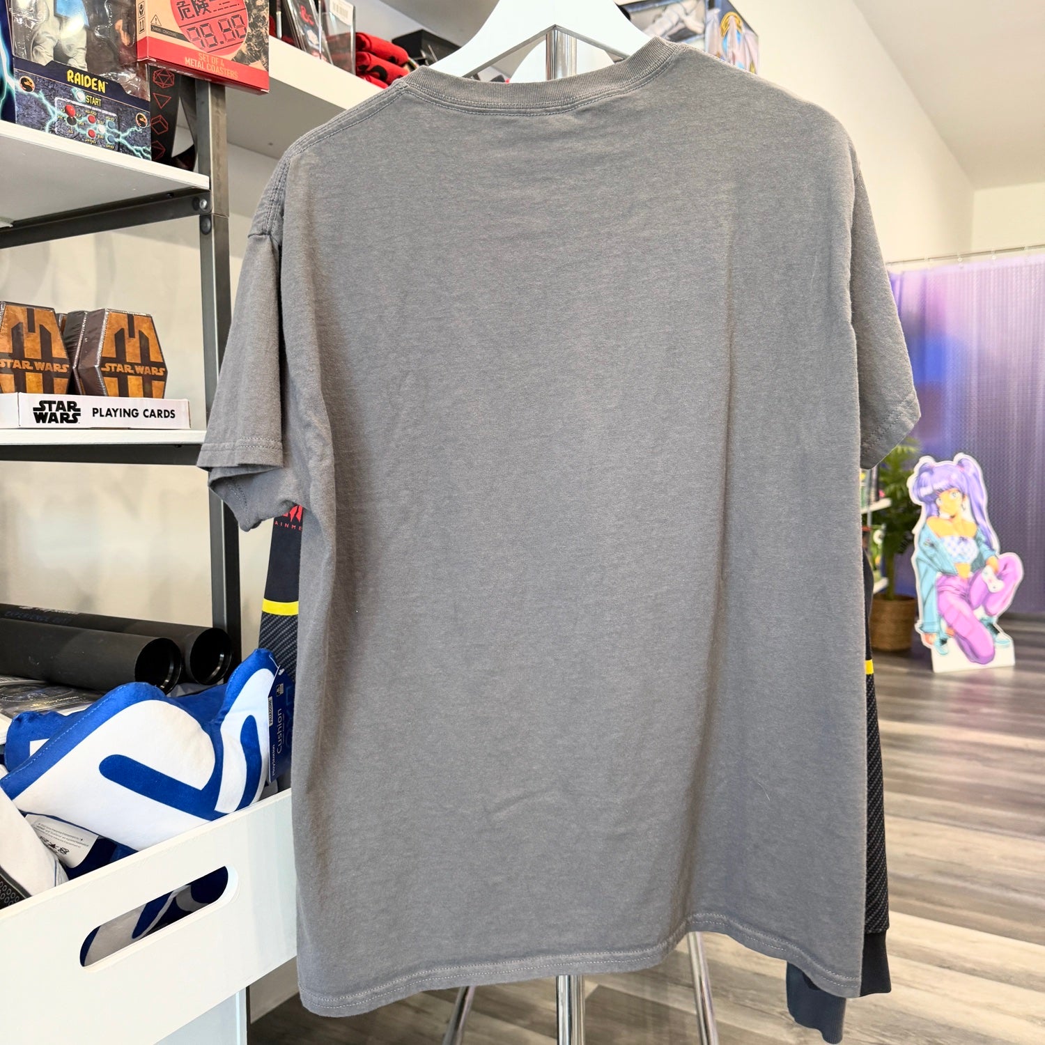 Gray t-shirt  in a store setting