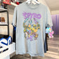 Gray t-shirt with 'Spyro' graphic design hanging on a rack in a store.