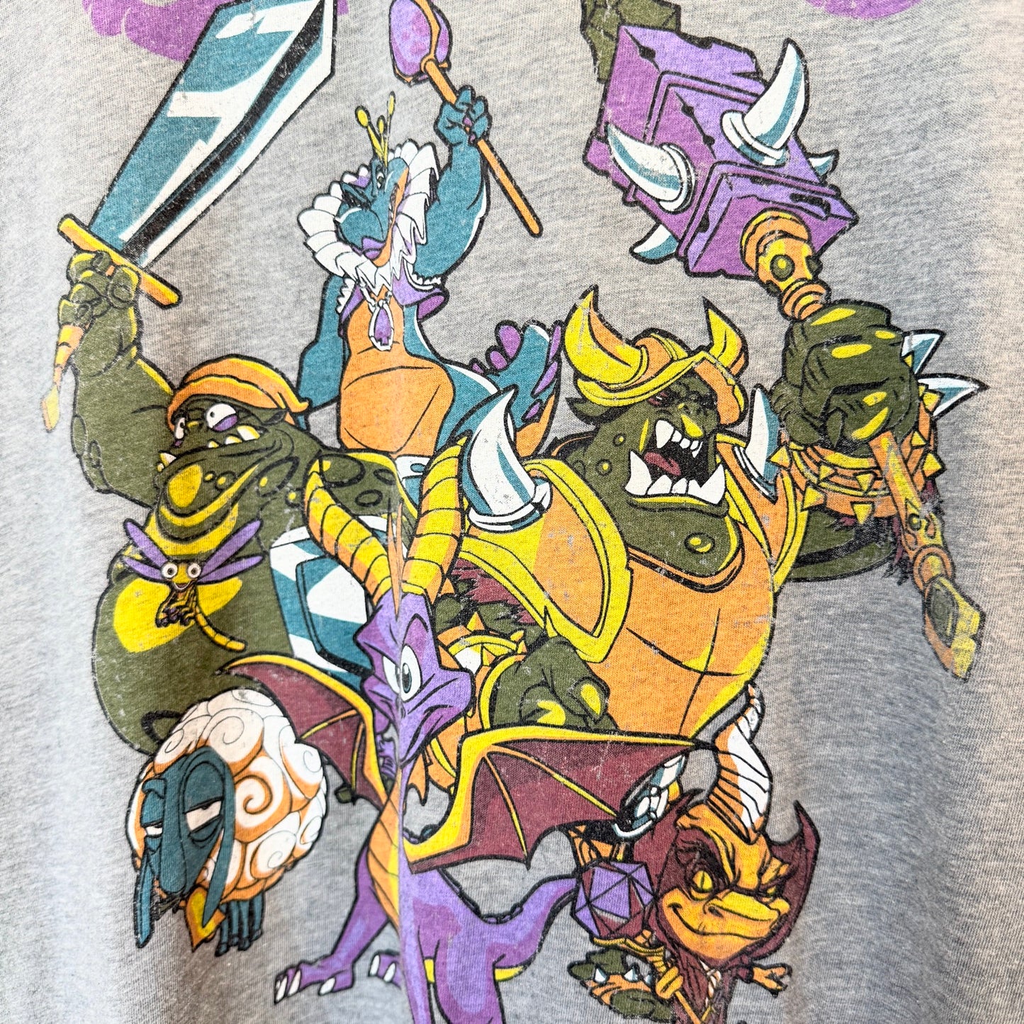 close of grey tshirt with Spyro graphic