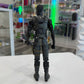 Action figure in a detailed costume standing on a white surface with a store shelf in the background.