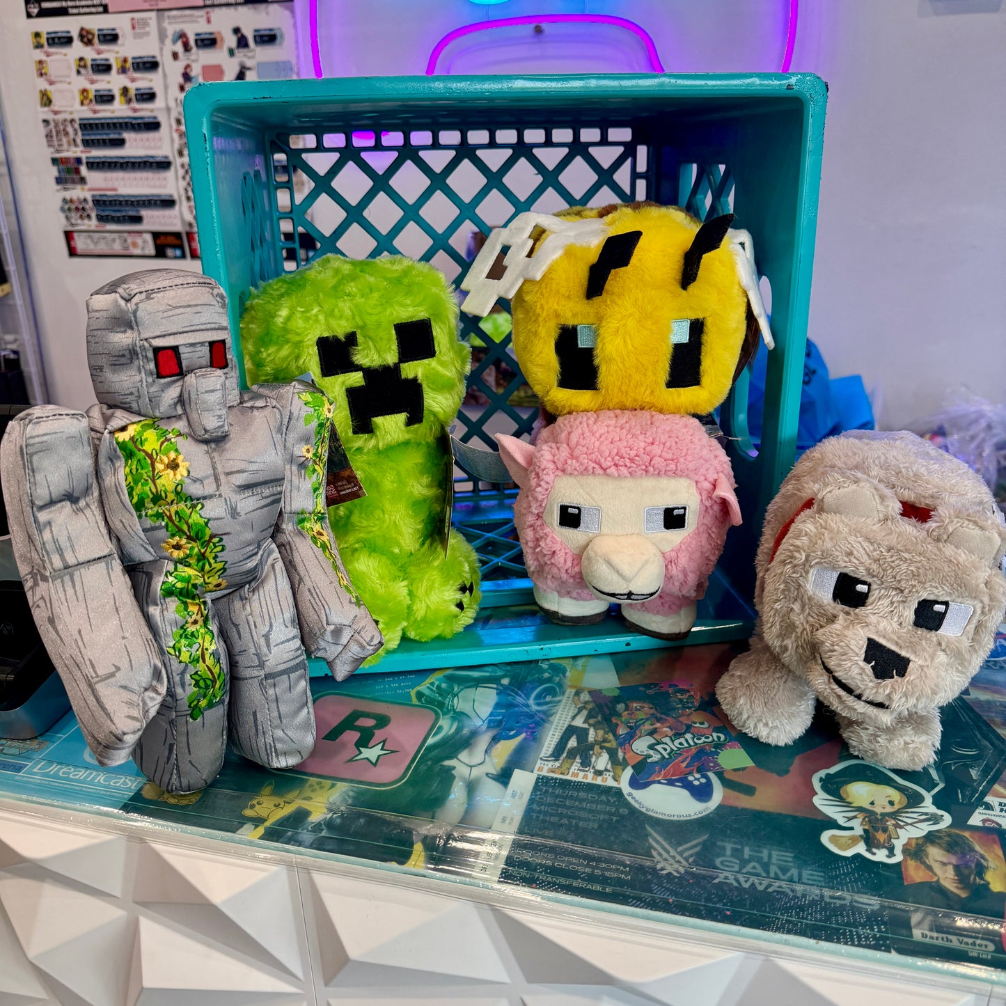 Assorted Minecraft plush toys displayed on the front counter of a store. 