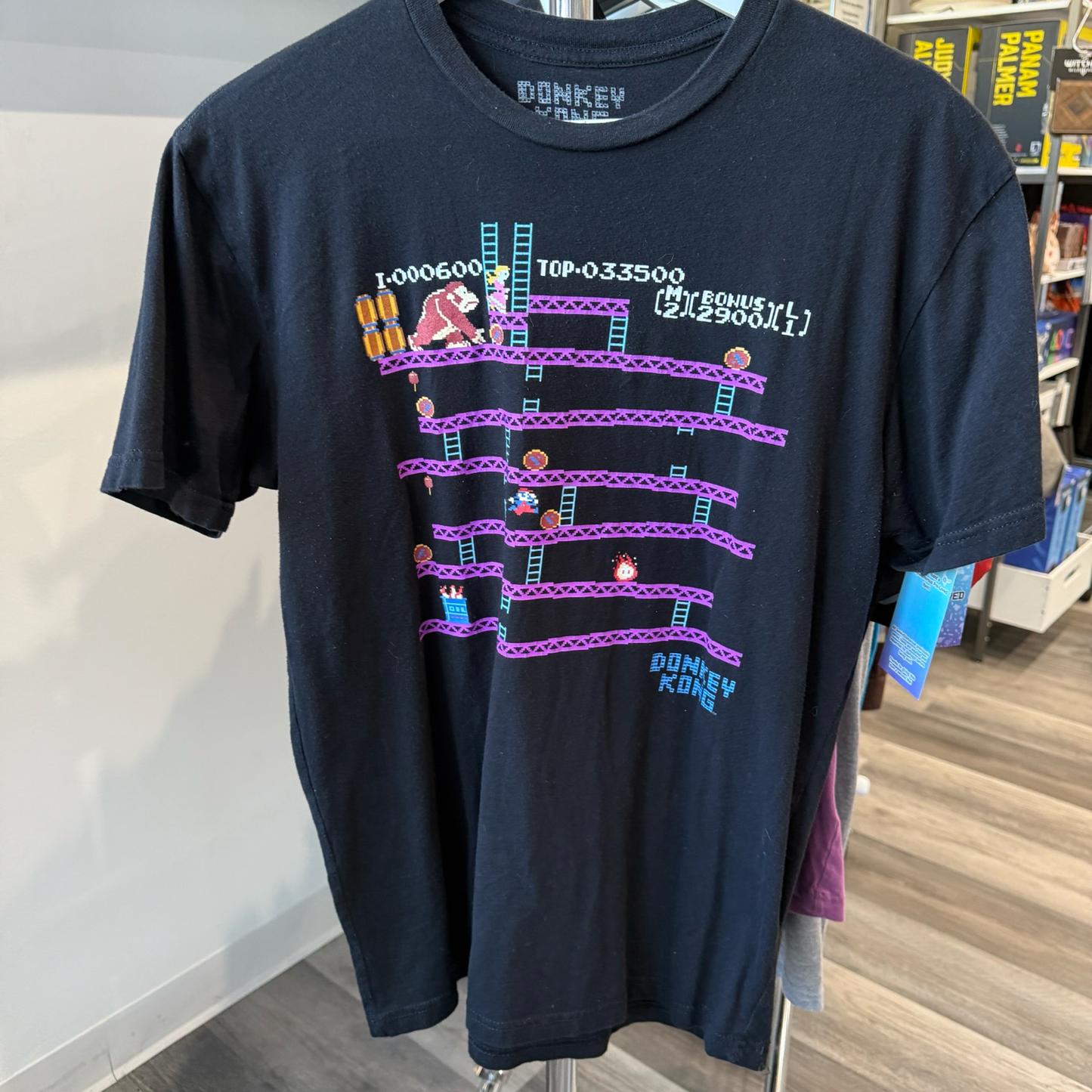 Black tshirt with classic Donkey Kong arcade graphic in purple and blue