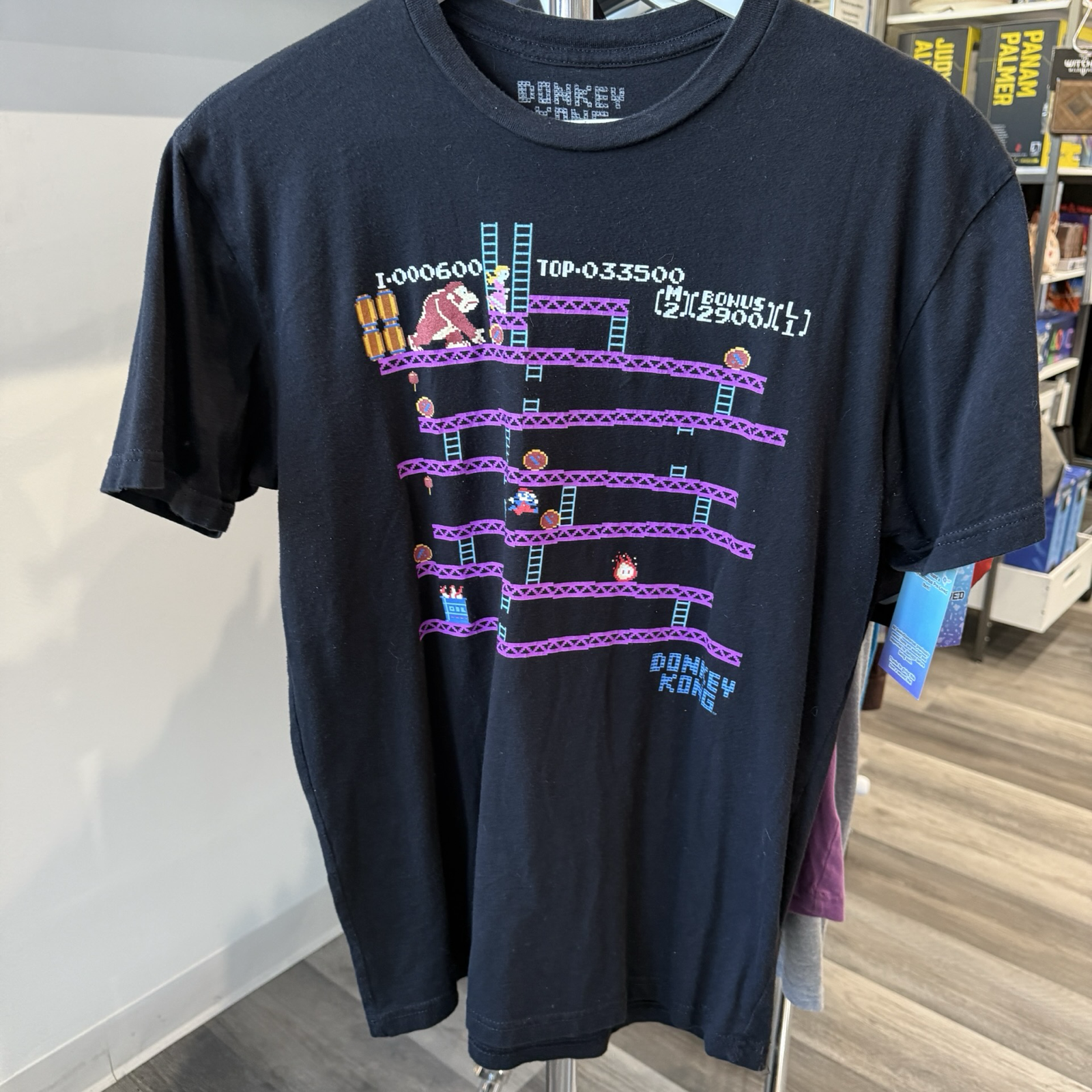 Black tshirt with classic Donkey Kong arcade graphic in purple and blue