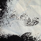 Close up of a white screenprint showing some missing paint/damage. 