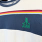 Close-up of a shirt with Atari logo and colorful stripes