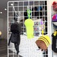 Three plush character keychains hanging from a white wire display grid in a retail store. 