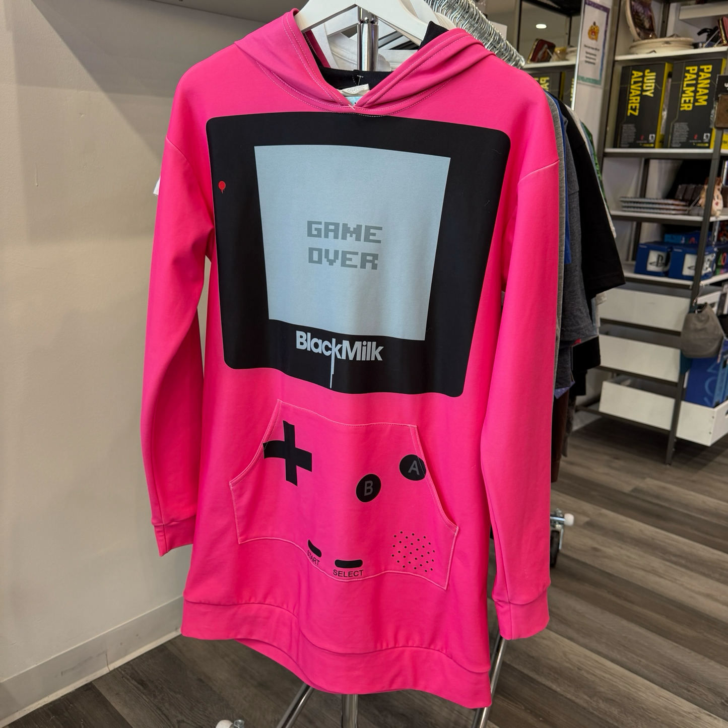 Hot pink hooded dress made to look like a Game Boy with large front kangaroo pocket. 