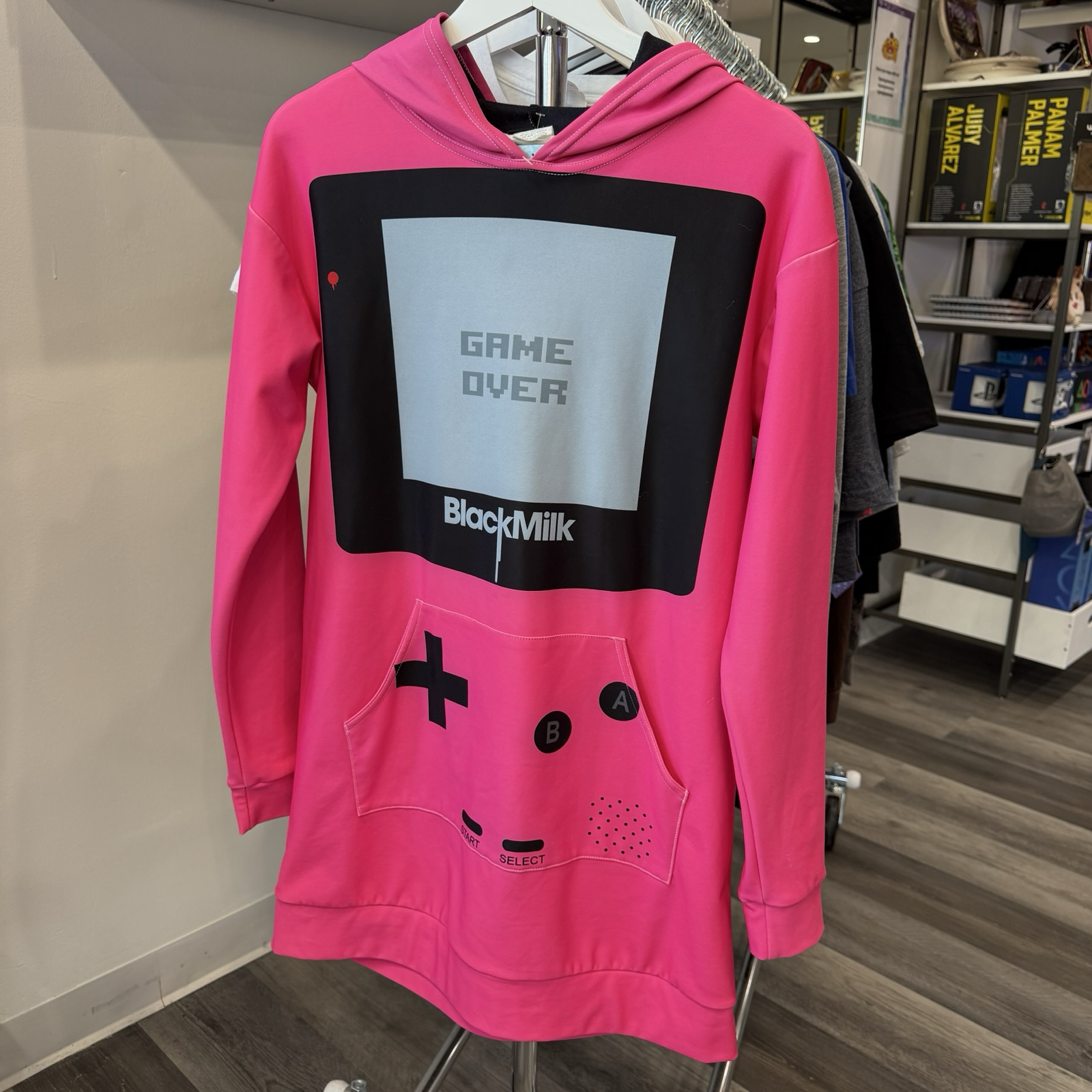 Hot pink hooded dress made to look like a Game Boy with large front kangaroo pocket. 