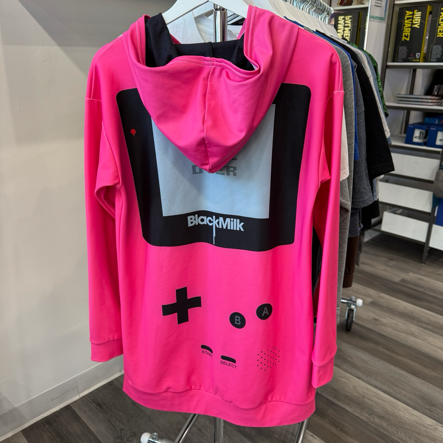 Back view of hot pink hooded dress made to look like a Game Boy with large front kangaroo pocket. 