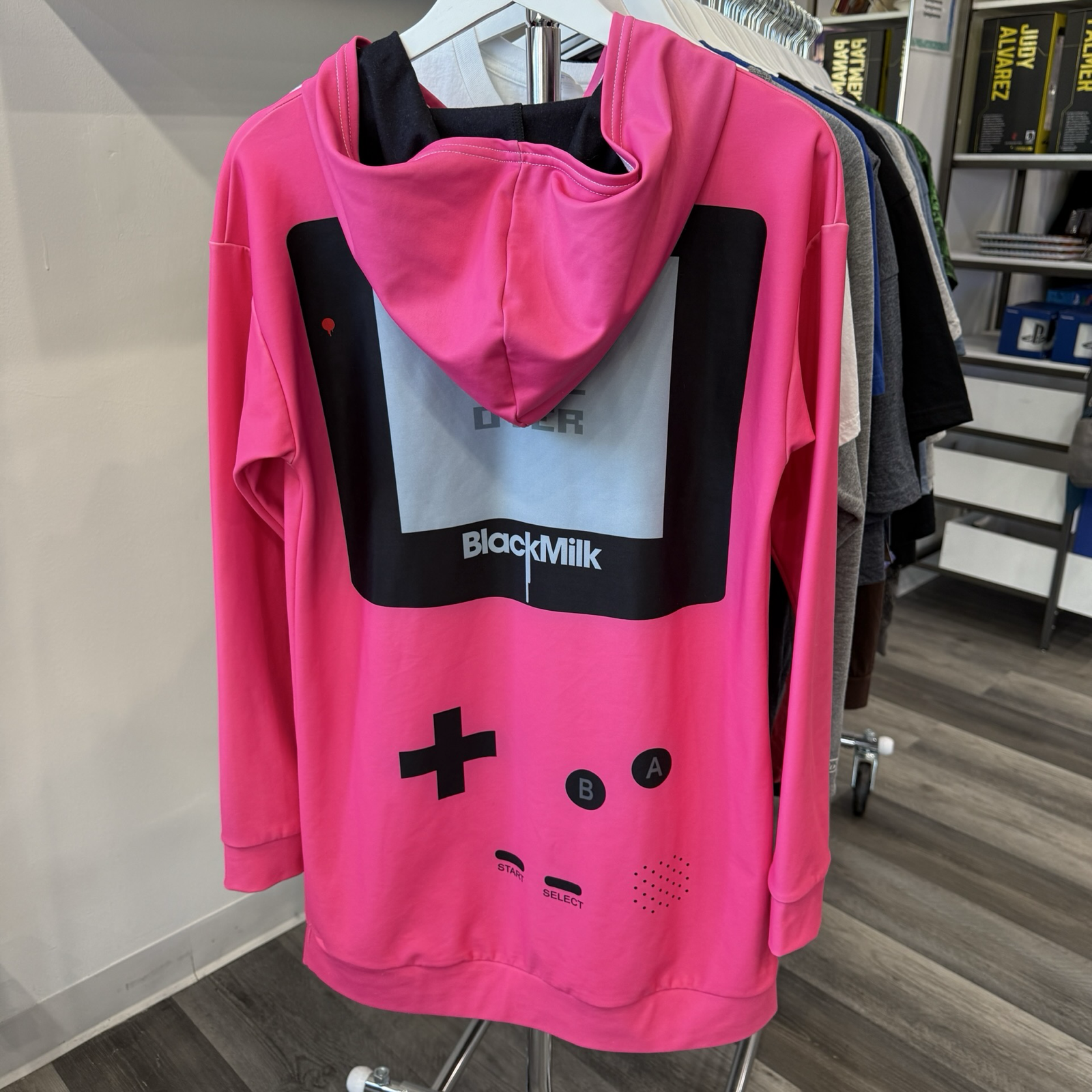 Back view of hot pink hooded dress made to look like a Game Boy with large front kangaroo pocket. 