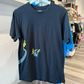 Black tshirt with Pikachu graphic and Charizard's tail