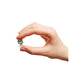 A hand holding a very small Shadow the Hedgehog figure against a plain white background.