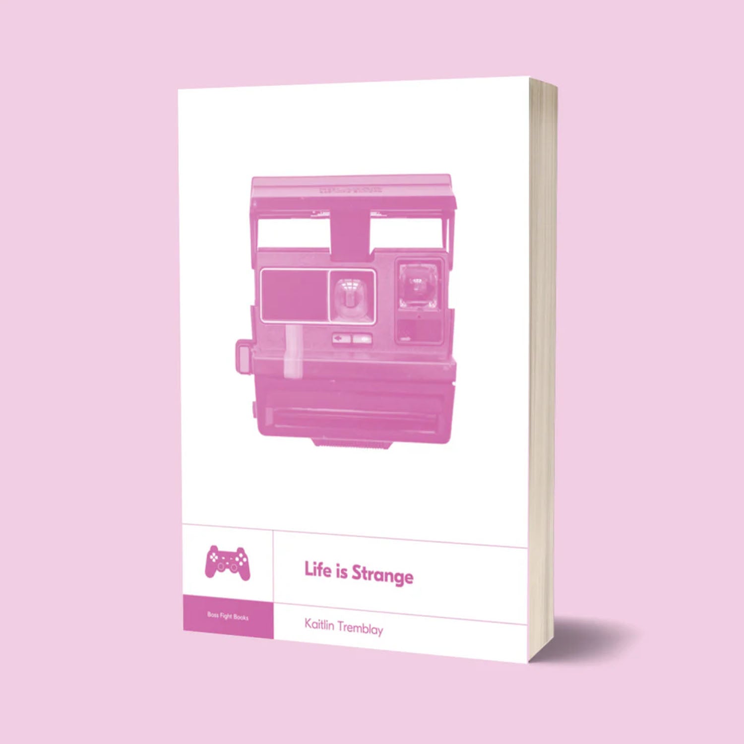 A book cover for 'Life is Strange' by Kallin Trimblay, featuring a pink graphic of a retro camera on a white background, set against a solid pink backdrop.