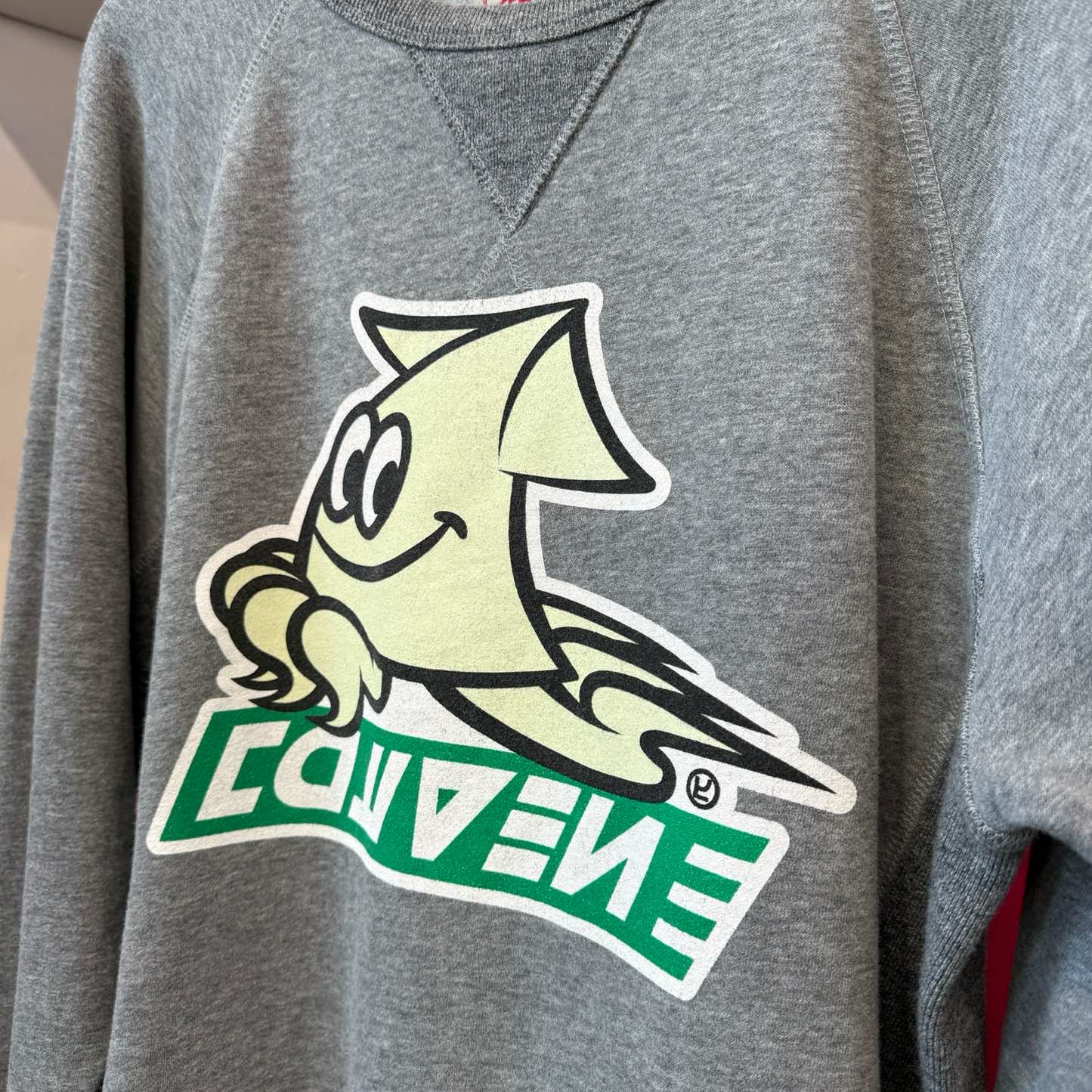 Grey pullover sweatshirt with cream color and green logo from the video game, Splaton. 