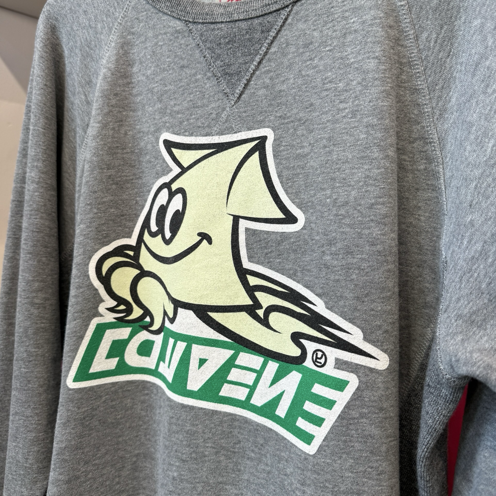 Grey pullover sweatshirt with cream color and green logo from the video game, Splaton. 