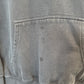 close up of sweatshirt pocket showing a few dark stains