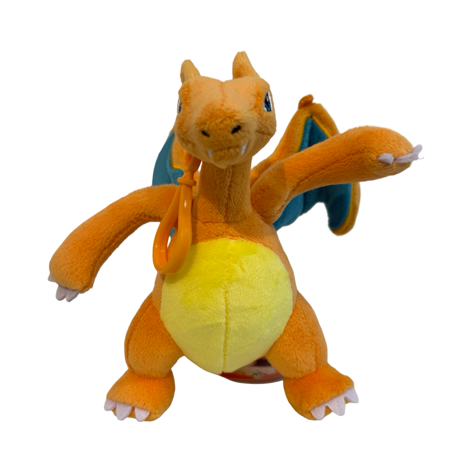 Plush keychain of Pokémon Charizard. Orange and yellow in color. 