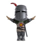 Toy figure of Solaire from Dark Souls wearing a helmet and sun tabard on a white background. 