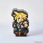A pixel-art collectible figurine of a fantasy character made from black, gray, yellow, blue, white, and orange blocks, standing on a light gray background. A copyright notice for SQUARE ENIX is visible in the bottom right corner.