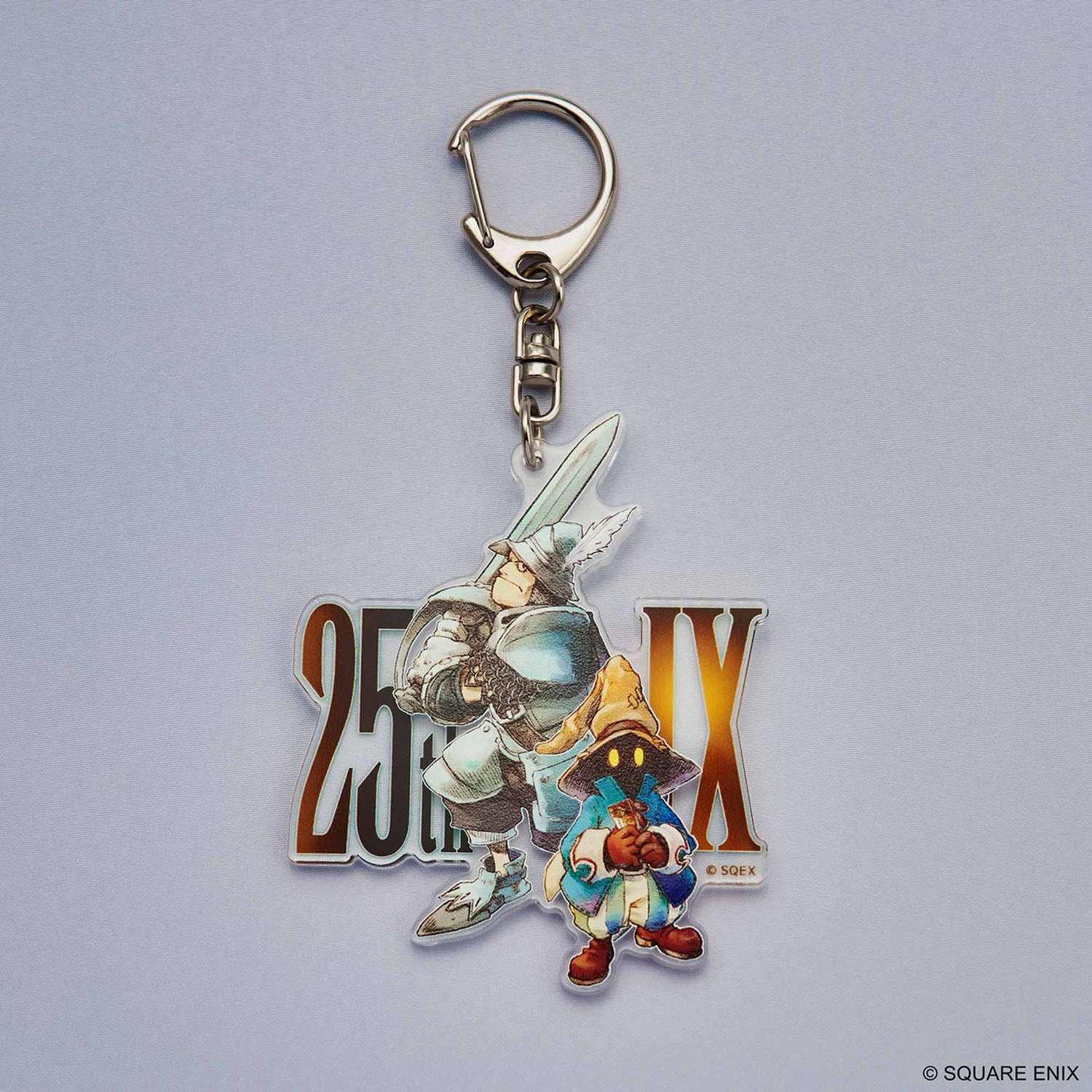 Acrylic keychain with design from Final Fantasy IX on a metal clasp. 