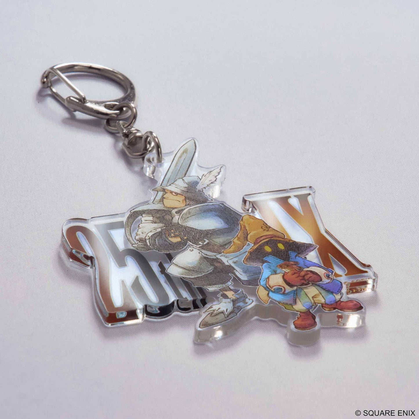 Acrylic keychain with design from Final Fantasy IX on a metal clasp. 