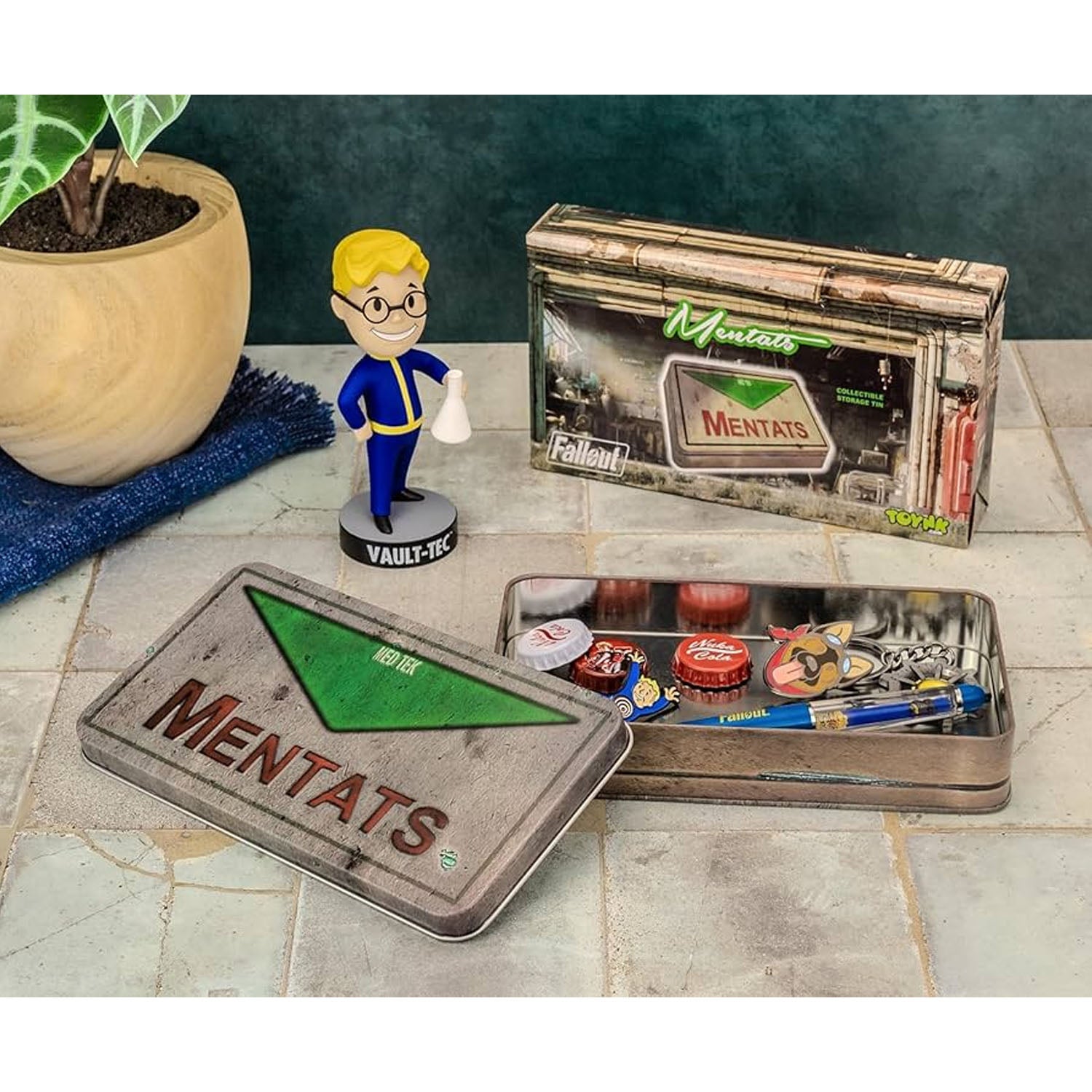 Fallout branded tems on a tile counter with Vault Tec bobble. head. 