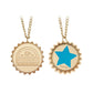 Two gold-tone bottle-cap style pendant necklaces on a white background, shown side by side. The left pendant is engraved with 'SUNSET SARSAPARILLA' and a small keg graphic, while the right pendant has a large blue star. 