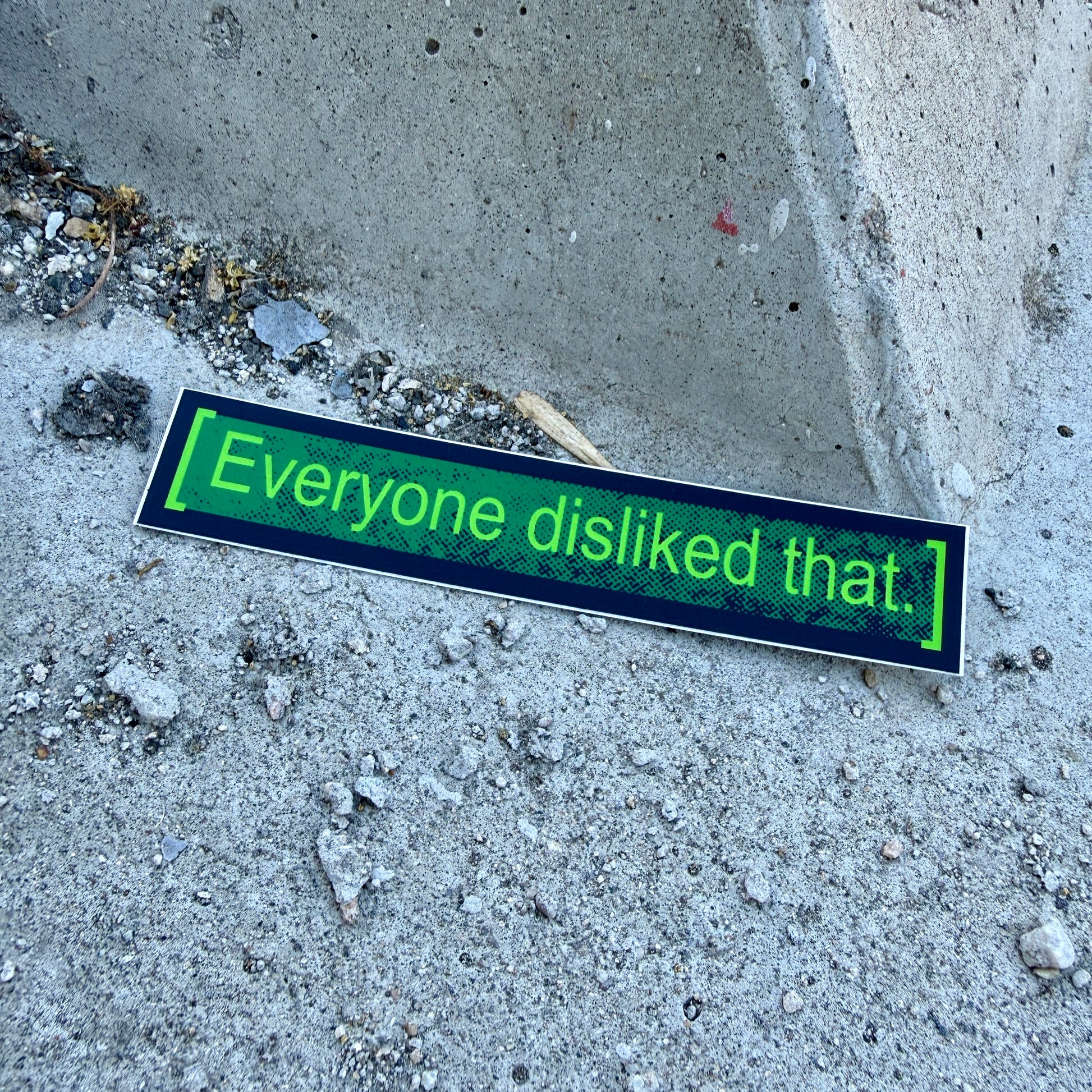 Sticker on concrete surface with text 'Everyone disliked that.'