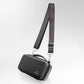 Black crossbody bag with a strap on a white background
