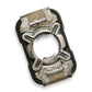 A single mechanical-looking rectangular accessory photographed on a plain white background. It has a dark outer frame with metallic silver and black central sections, plus small gold-toned ridged details near the top and bottom.