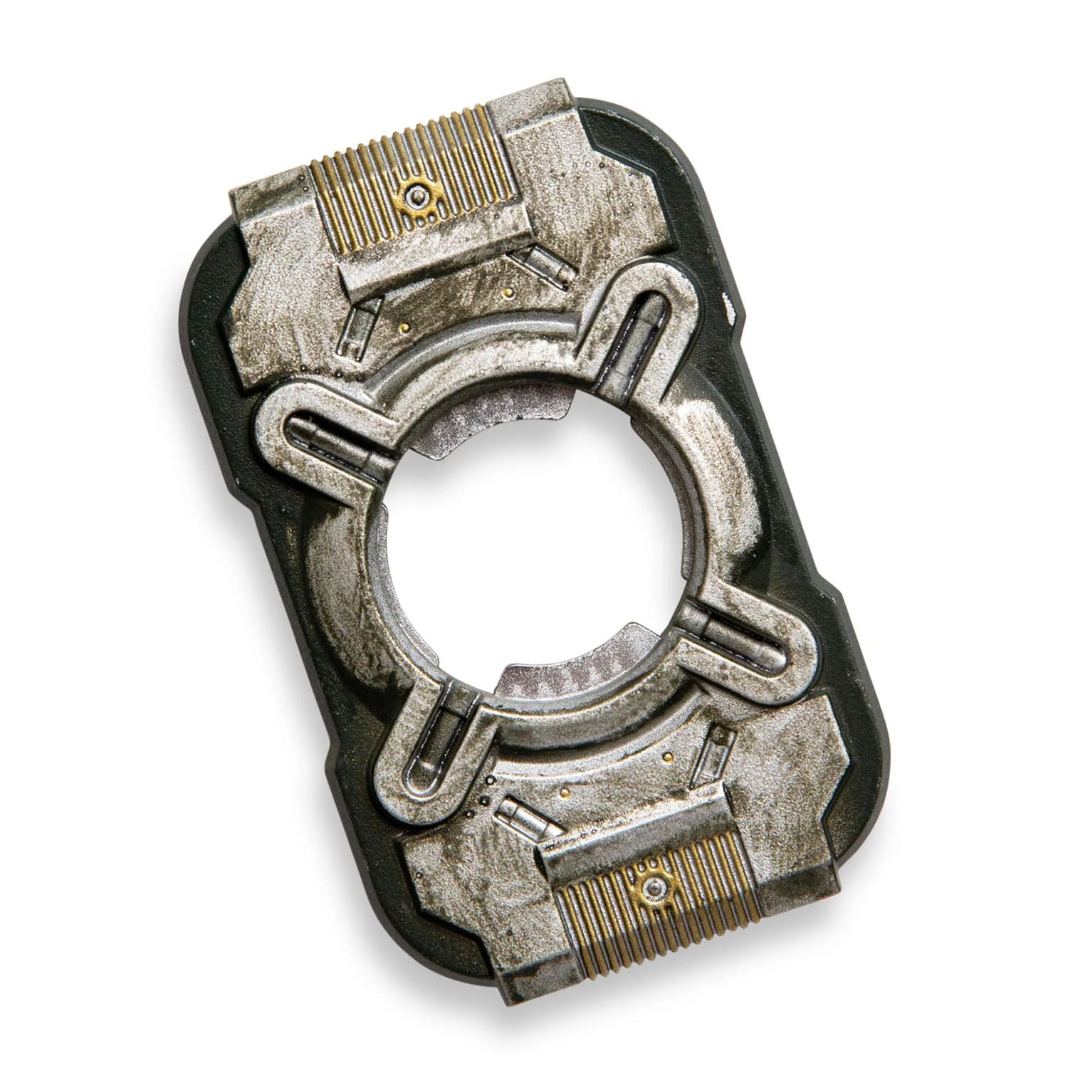 A single mechanical-looking rectangular accessory photographed on a plain white background. It has a dark outer frame with metallic silver and black central sections, plus small gold-toned ridged details near the top and bottom.