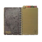 Lined page spiral notebook with tabs. 
