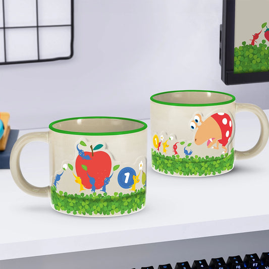 Two ceramic mugs with Pikmin motif on a shelf. 