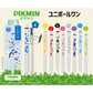 Pikmin UniBall retractable gel pens displayed on a light beige background with green grass-like graphics at the bottom. The image shows the retail box, several loose pens in different color schemes, and printed Japanese text including the Pikmin brand name.