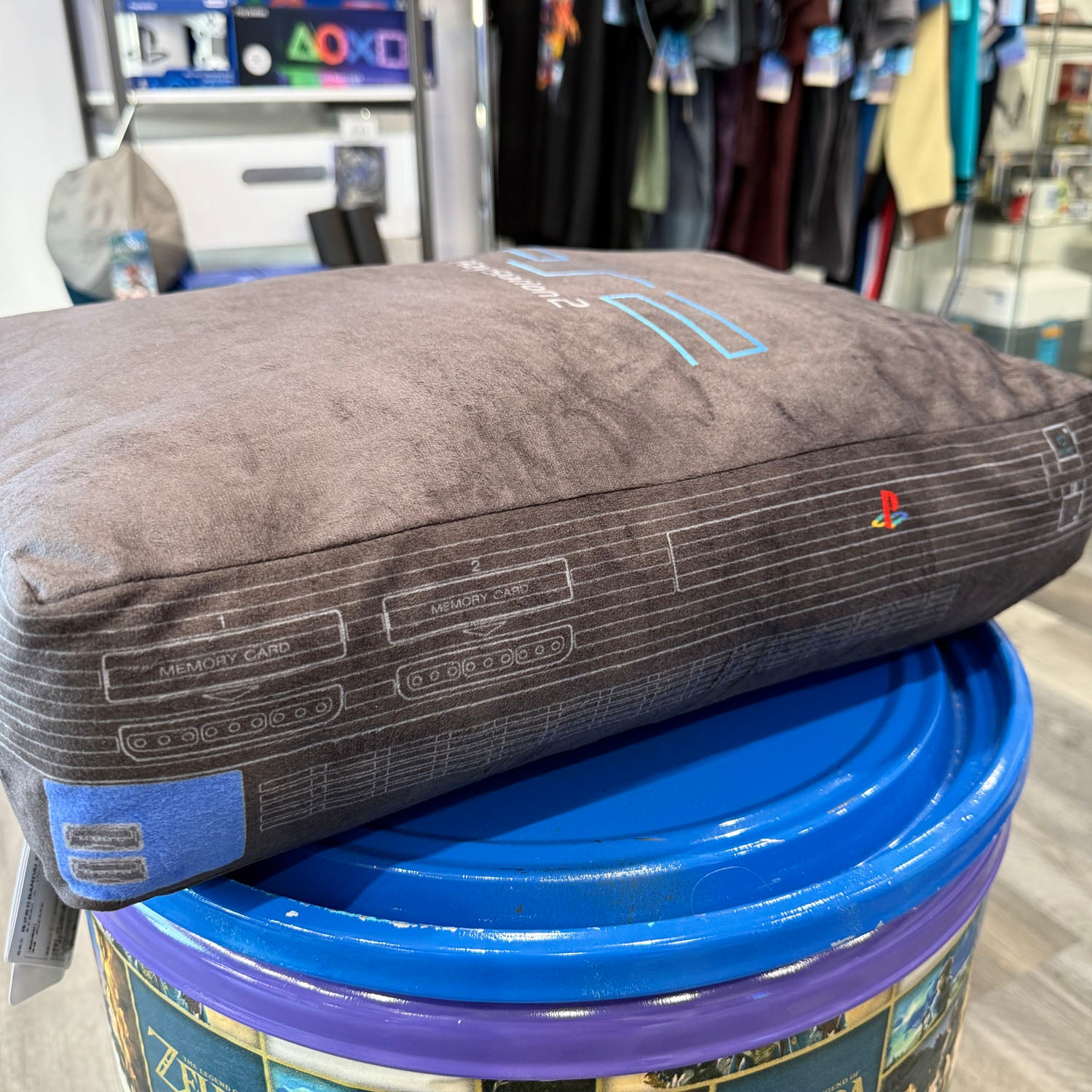 Pillow made to look like a PlayStation 2 console. Black with blue logo. 