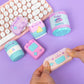 Pastel-colored squishy toys with a keyboard on a purple background, featuring the Pusheen brand.