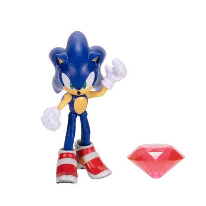 A Sonic the Hedgehog action figure standing on a white background, shown alongside a small translucent red gem accessory.