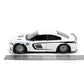 White model car with black accents on a white background, accompanied by a ruler for scale showing 8" long.